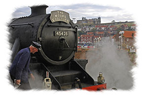 North Yorkshire Moors Railway - Steam engine and Whitby Abbey