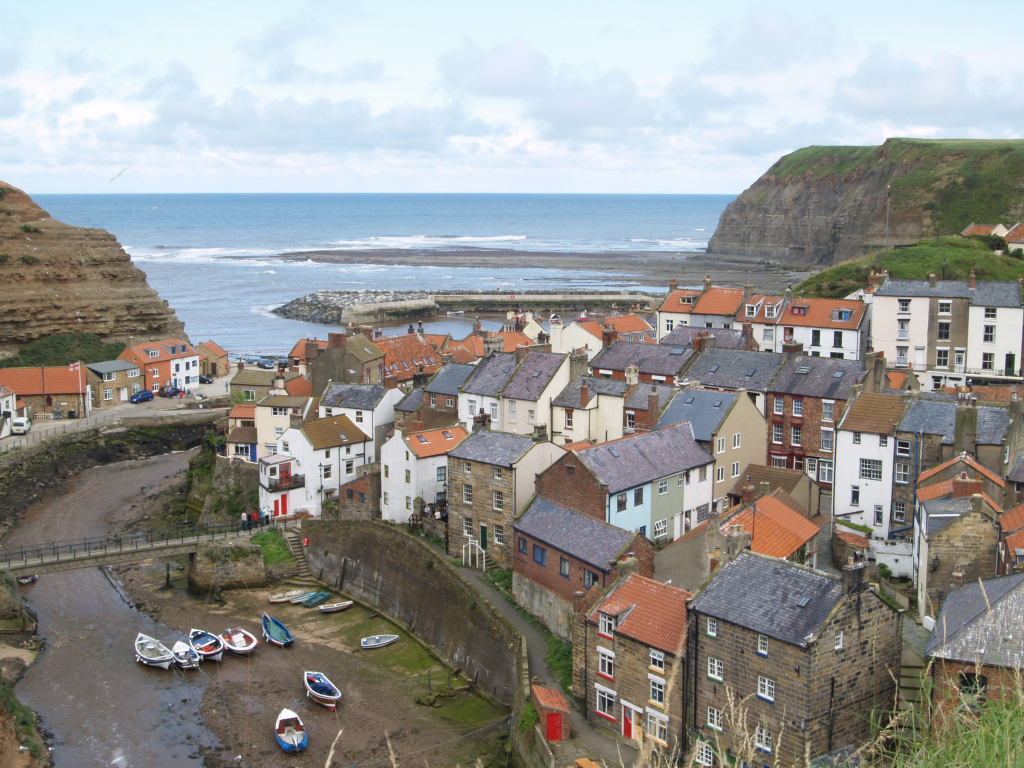 Picture of Staithes Harbour over the rooftops of its cottages