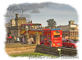 Picture of a City of York Sightseeing Bus crossing Lendal Bridge
