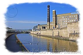 Aire Valley Canal Walk. Picture of Damart Mill Chimney across the canal at Bingley